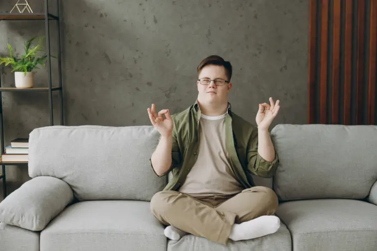 Man meditates comfortably with Your Best Life Independent Living Disability Accommodation.